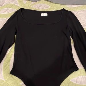 Black long sleeved body suit